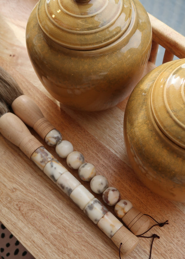 Decorative brush with red stones