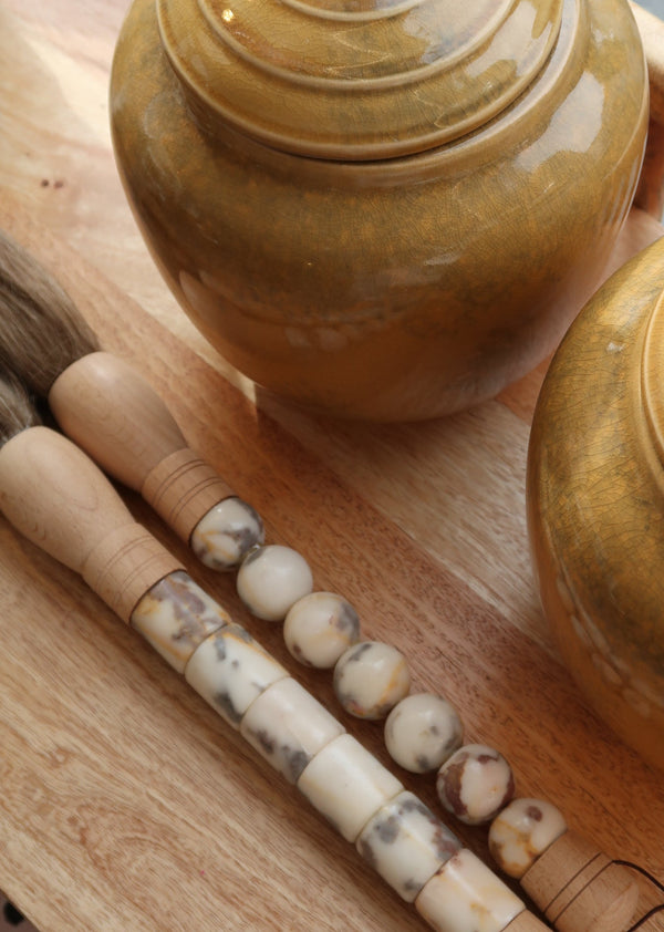 Decorative brush with red stones