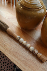 Decorative brush with red stones