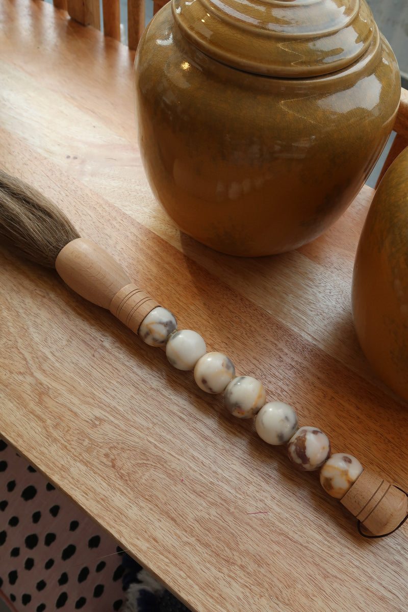 Decorative brush with red stones