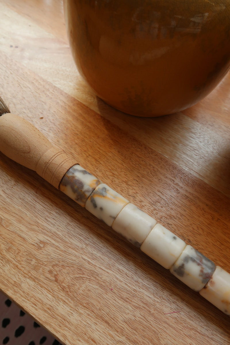 Decorative brush with red stones