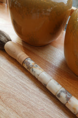 Decorative brush with red stones