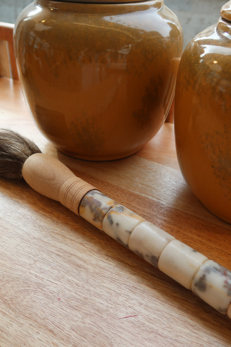 Decorative brush with red stones