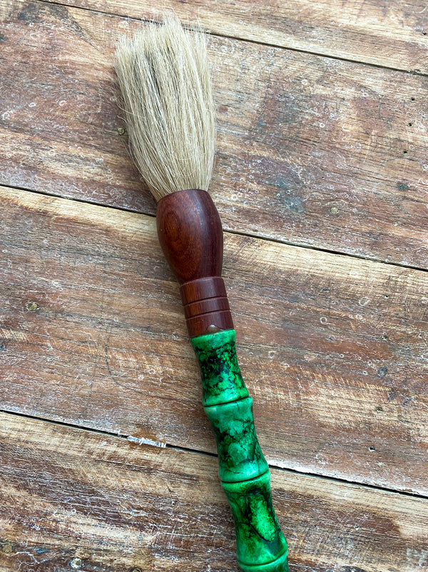 Decorative brush with green stones