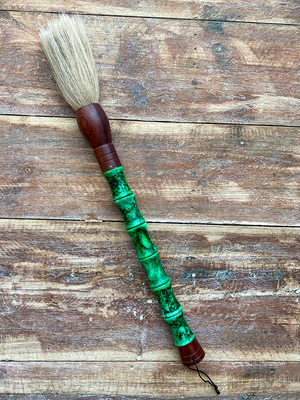 Decorative brush with green stones