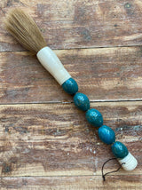 Decorative brush with turquoise blue stones