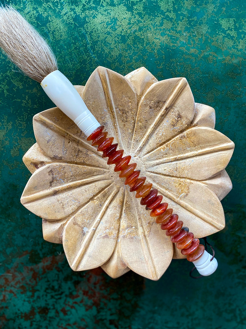 Decorative brush with brown coloured stones