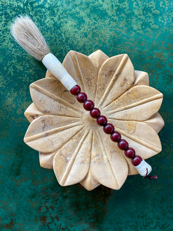 Decorative brush with brown stones