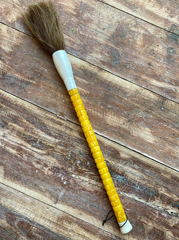 Decorative brush with small yellow stones