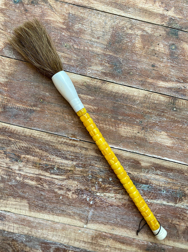 Decorative brush with small yellow stones