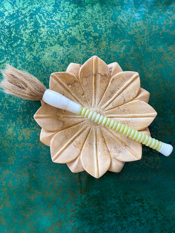 Decorative brush with pale yellow stones