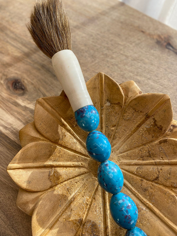 Decorative brush with blue stones and pink nuances