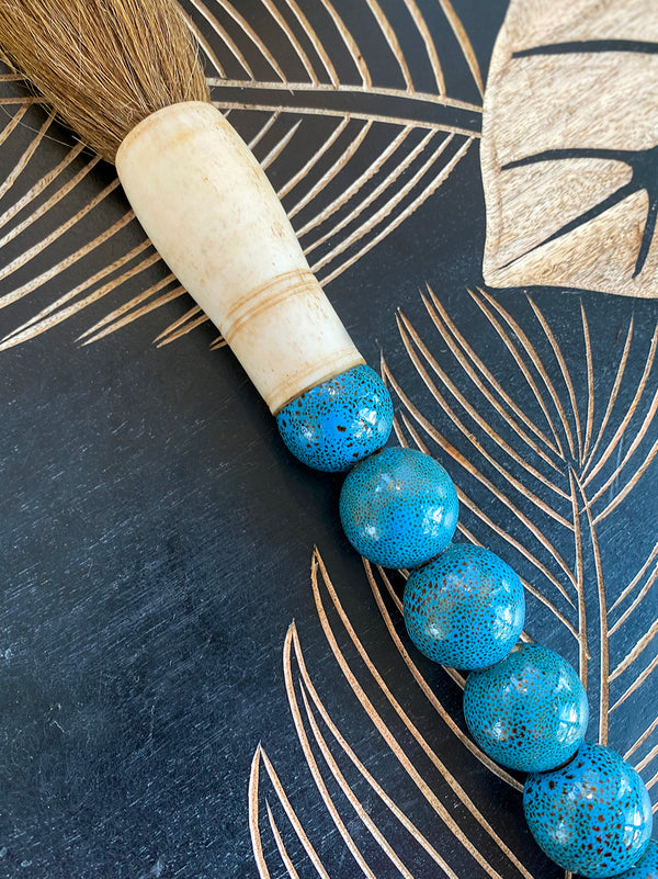 Decorative brush with blue round stones