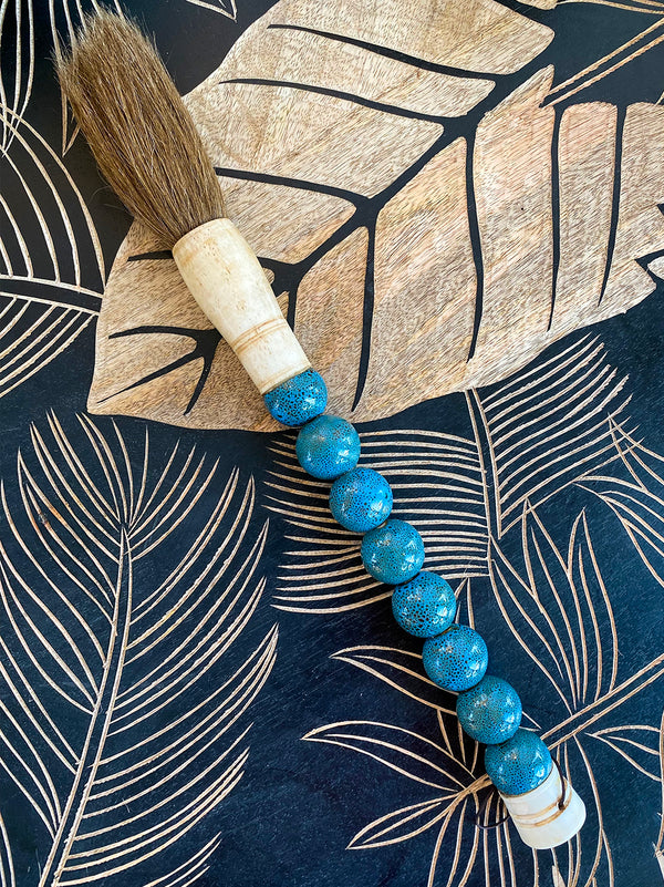 Decorative brush with blue round stones