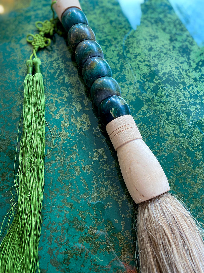 Blue-green decorative brush with green fringe